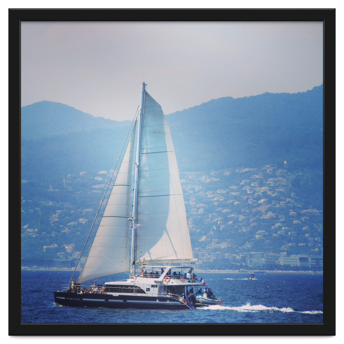 Modern yacht with white sails