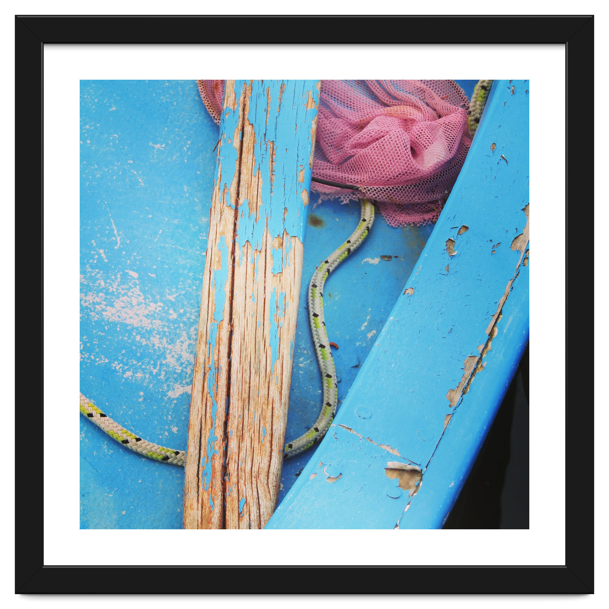 Weathered boat, sail and oar