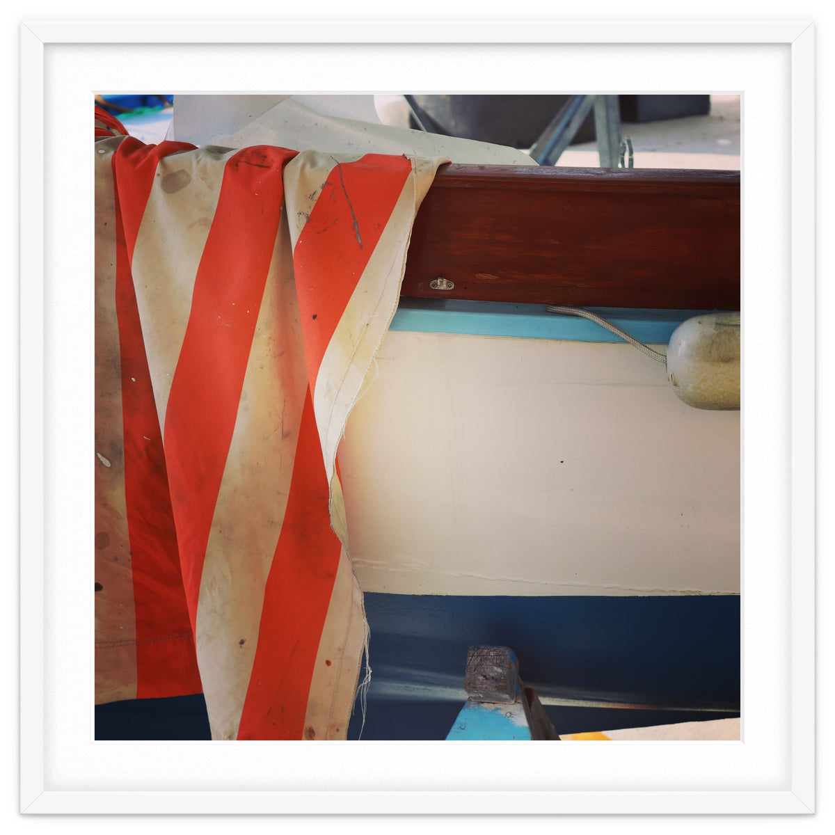 Fishing boat and striped sail