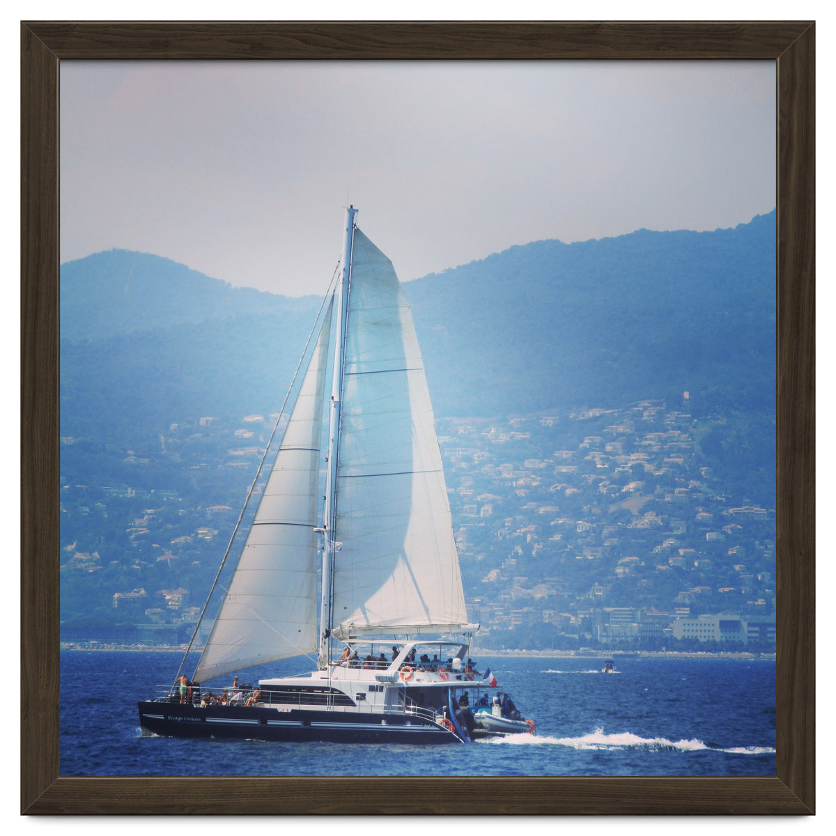 Modern yacht with white sails