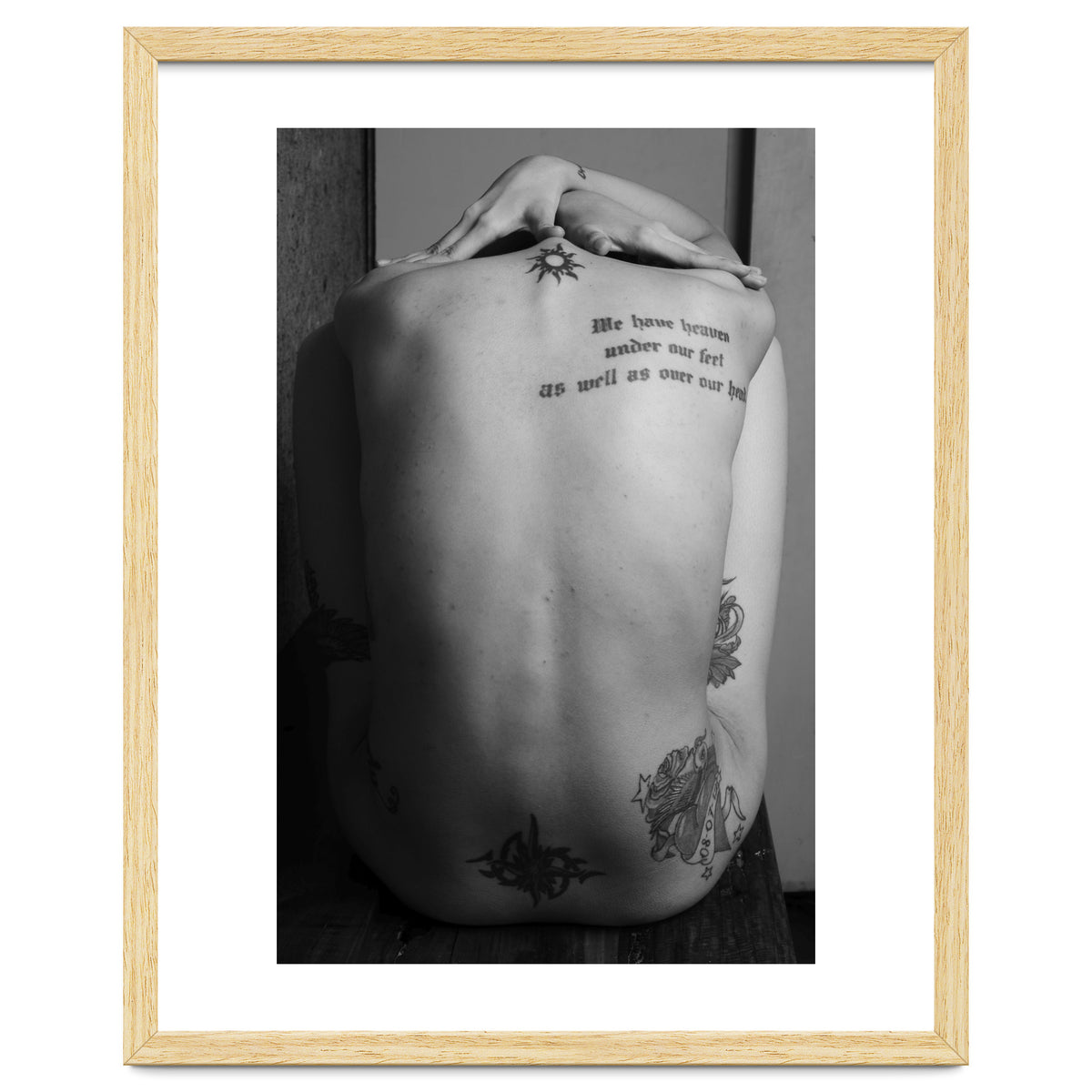 Naked body with saying as tattoo