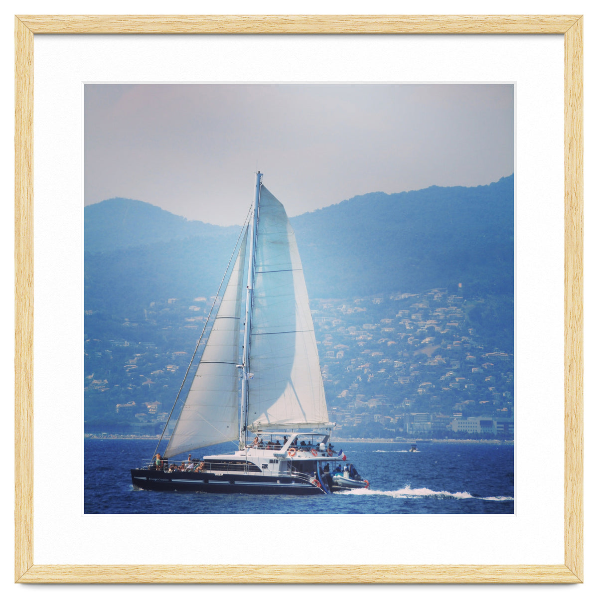 Modern yacht with white sails