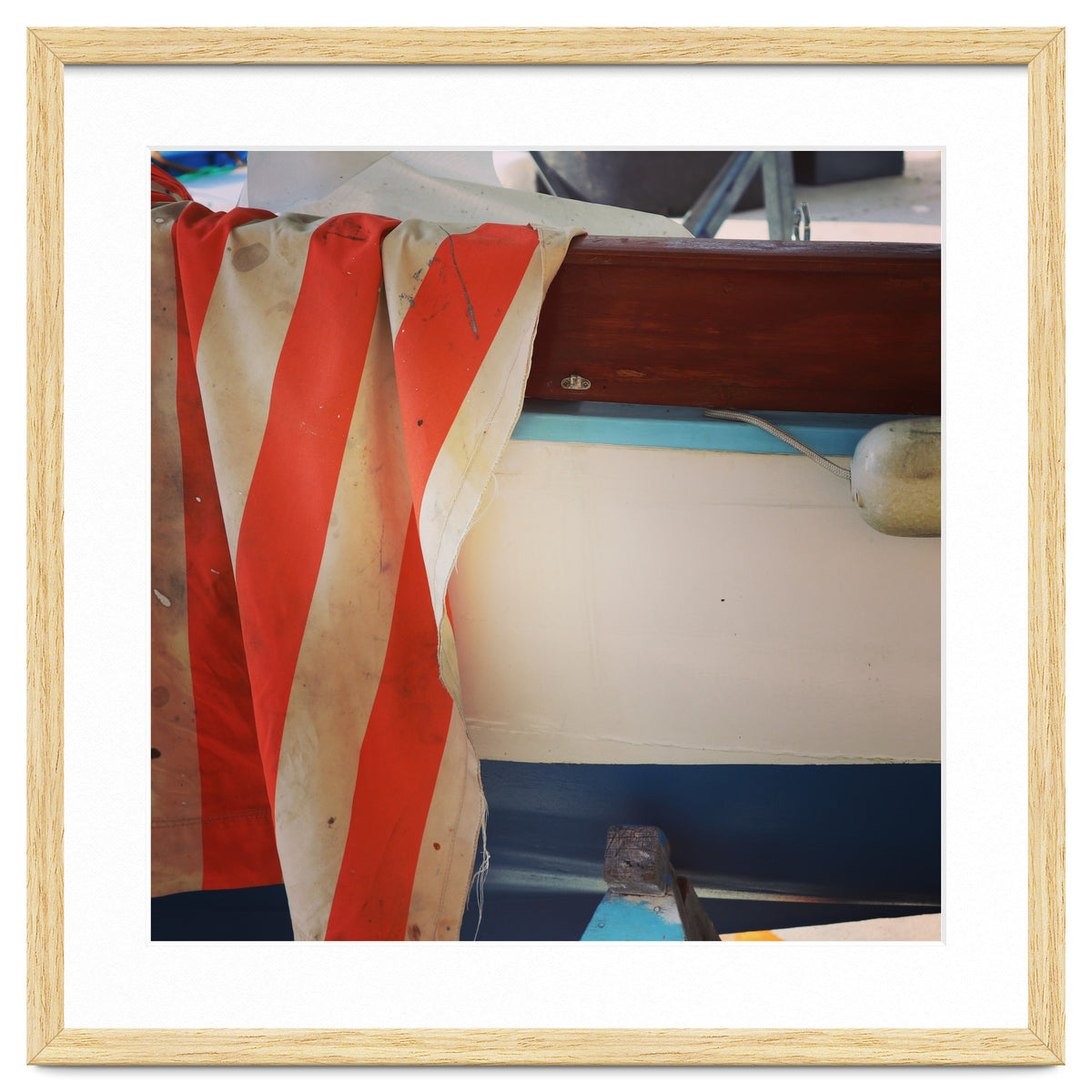 Fishing boat and striped sail