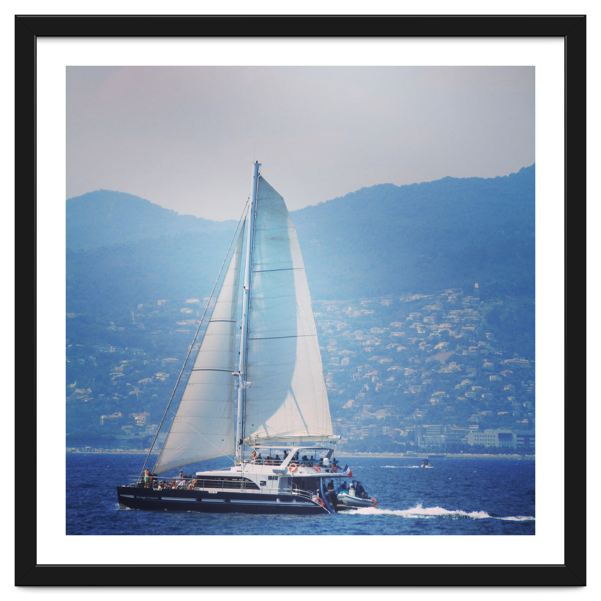 Modern yacht with white sails