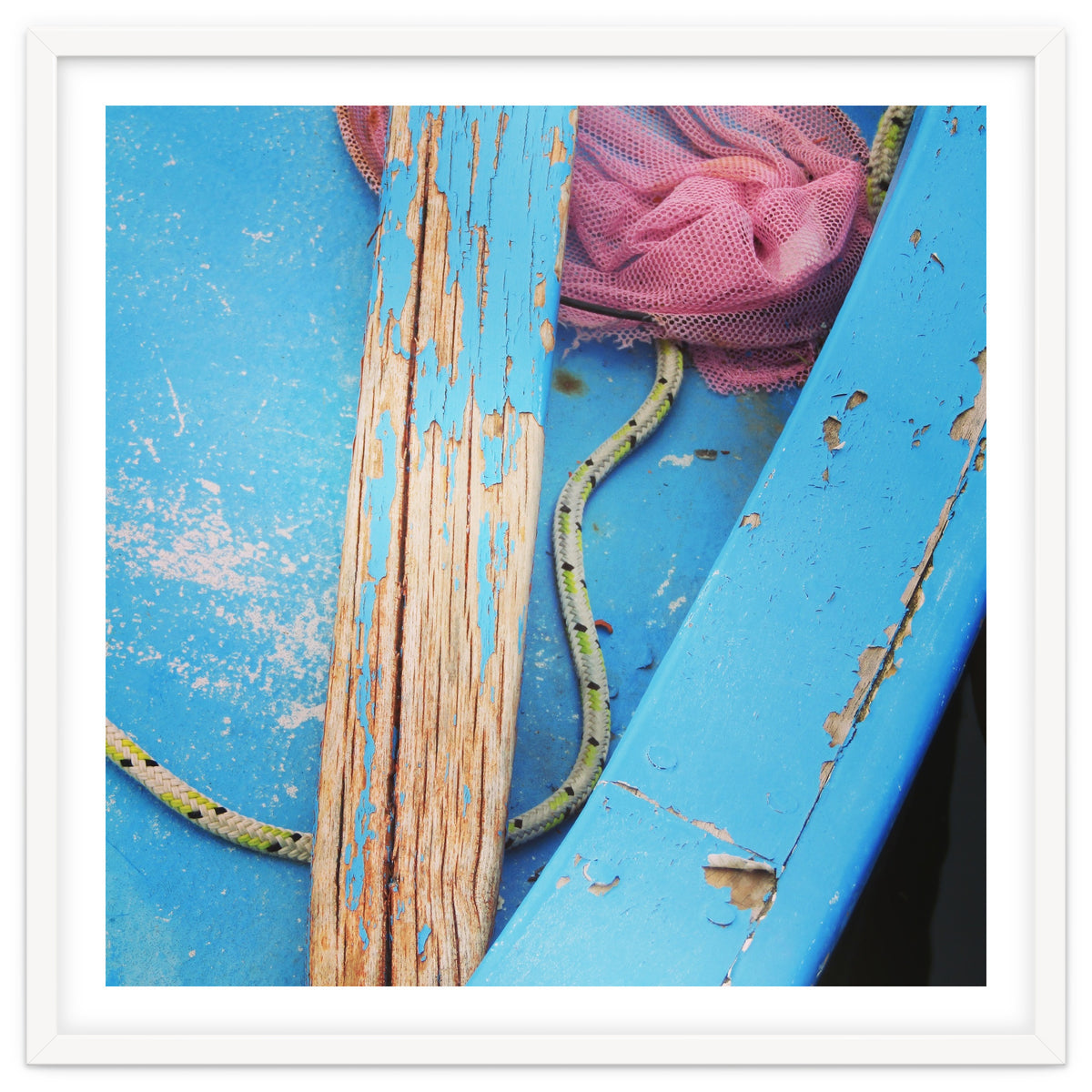 Weathered boat, sail and oar