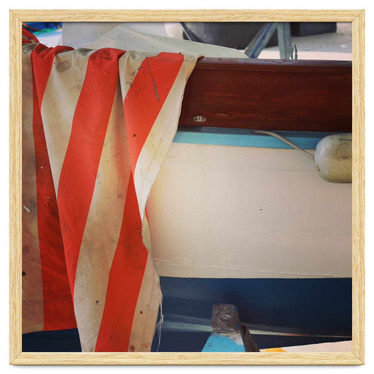 Fishing boat and striped sail