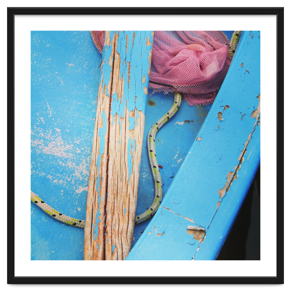 Weathered boat, sail and oar