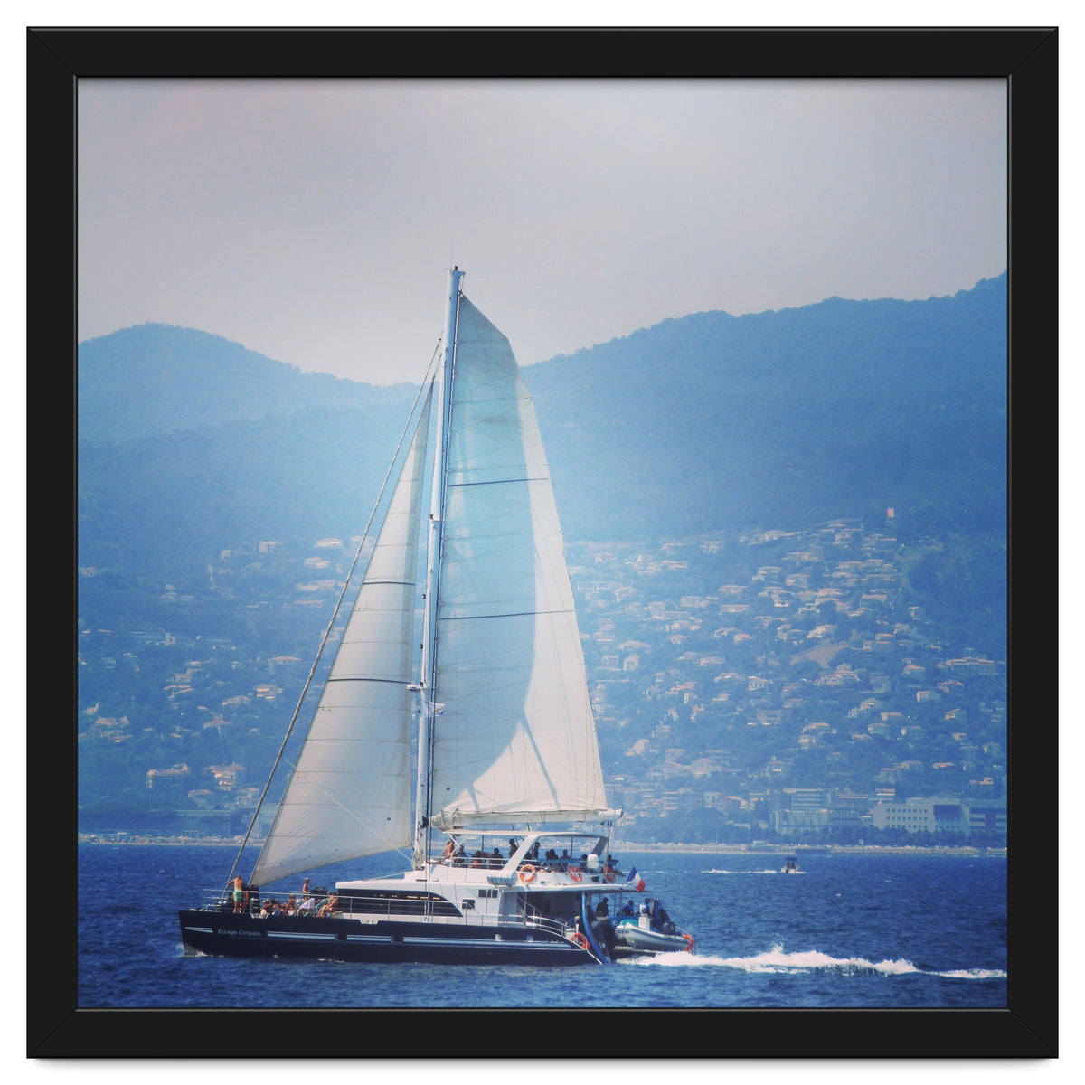 Modern yacht with white sails