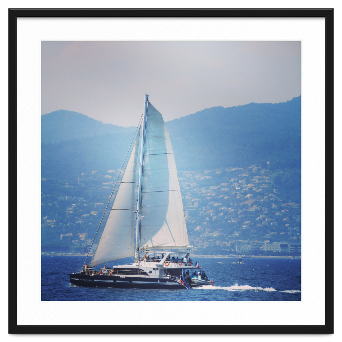 Modern yacht with white sails