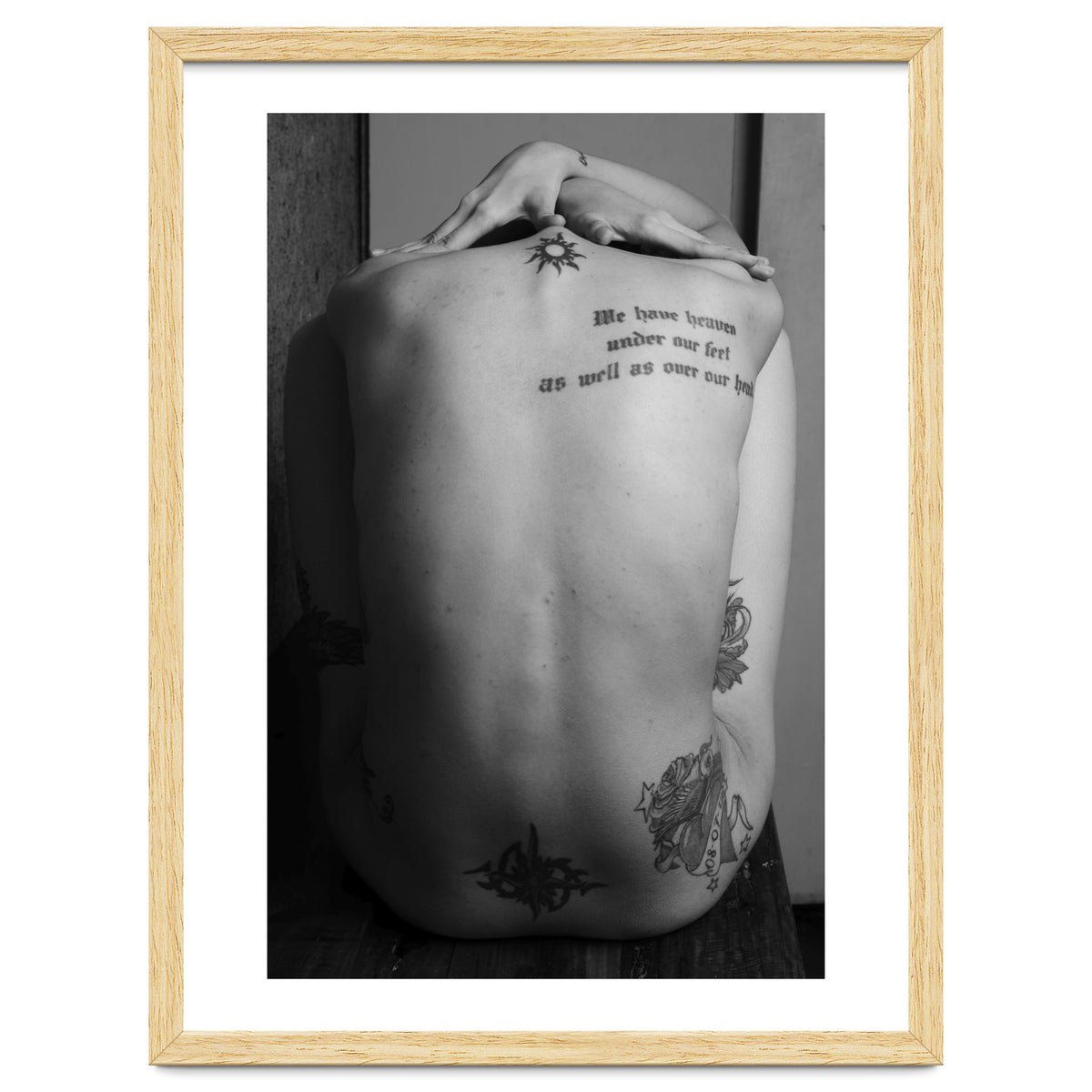 Naked body with saying as tattoo