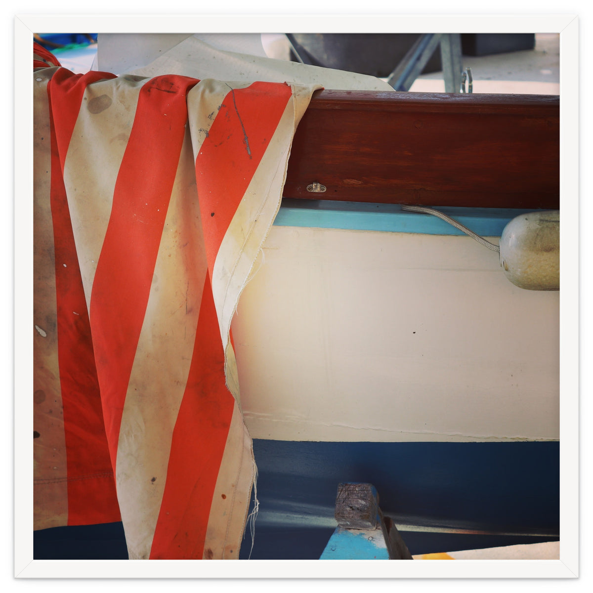 Fishing boat and striped sail