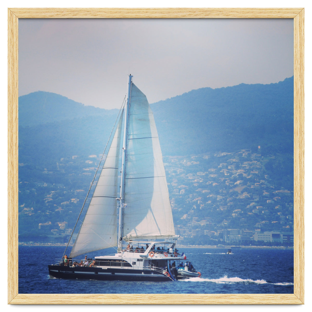 Modern yacht with white sails