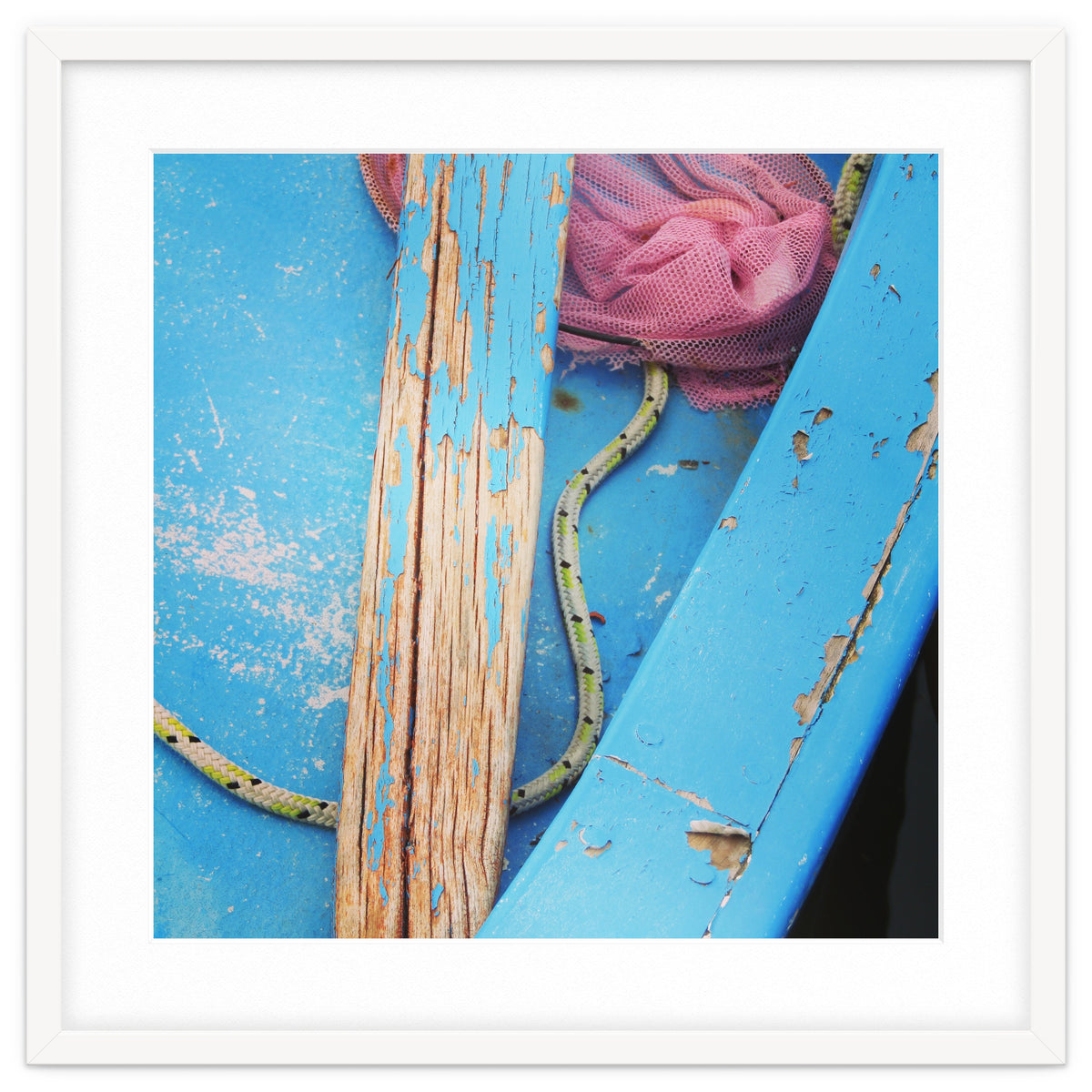 Weathered boat, sail and oar