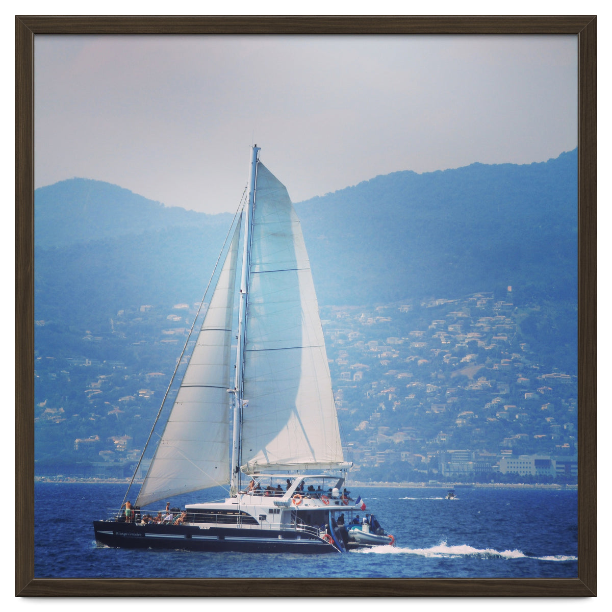 Modern yacht with white sails