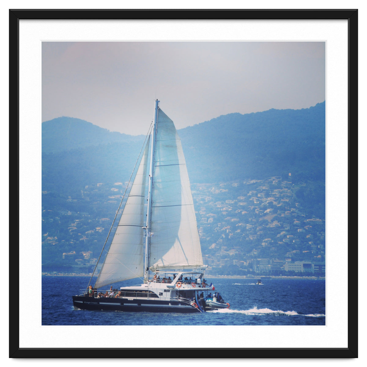 Modern yacht with white sails