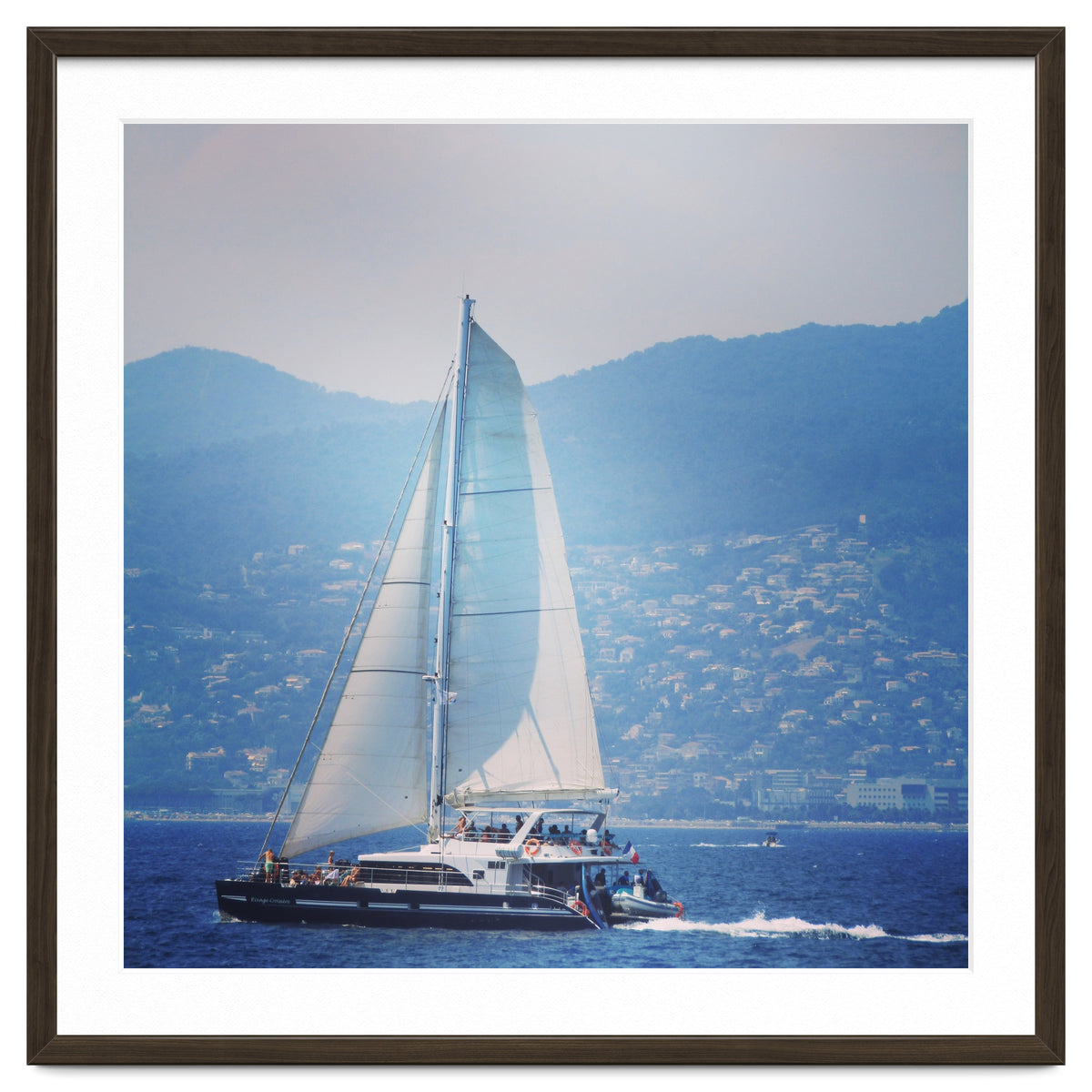 Modern yacht with white sails