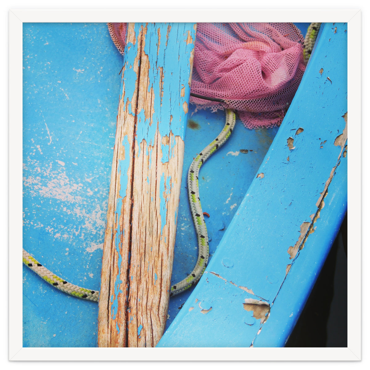 Weathered boat, sail and oar