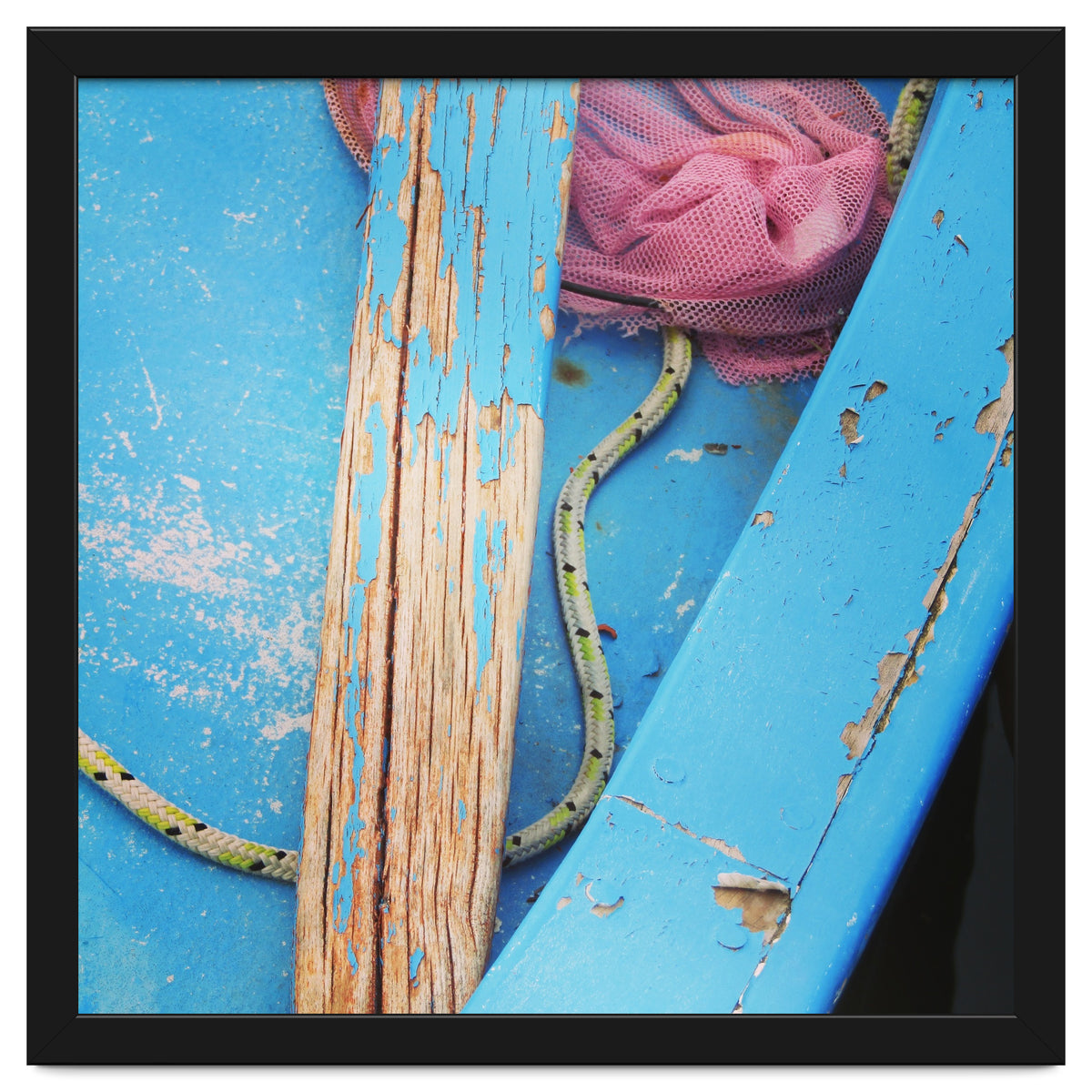 Weathered boat, sail and oar