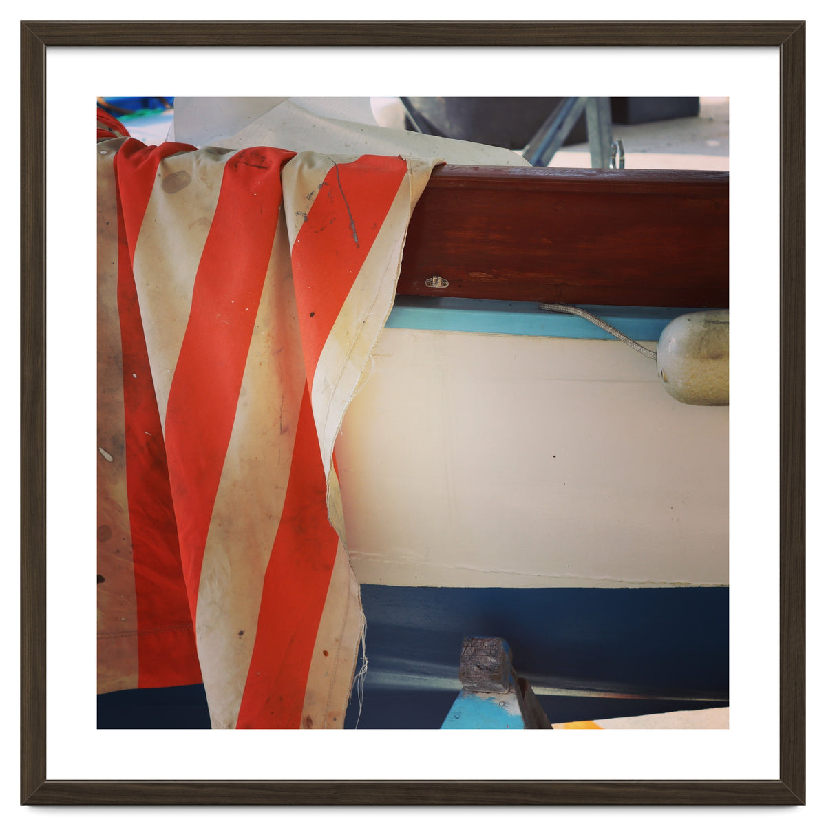 Fishing boat and striped sail