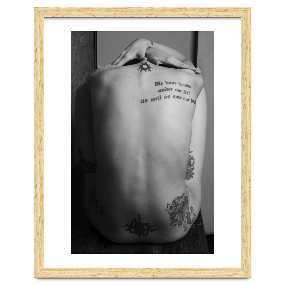 Naked body with saying as tattoo