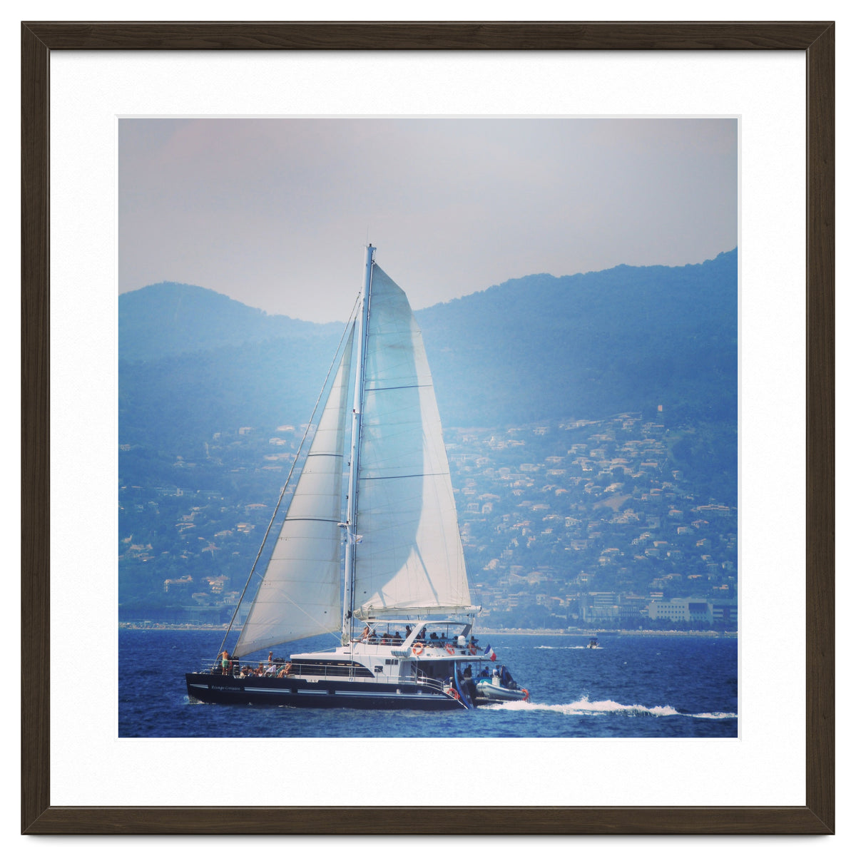 Modern yacht with white sails