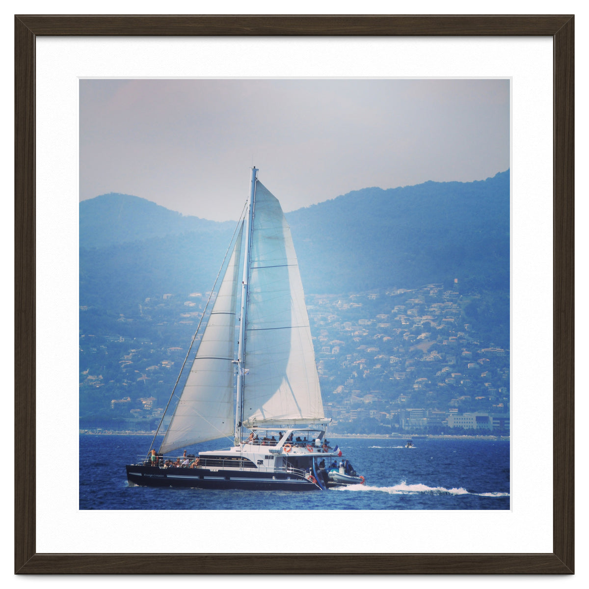 Modern yacht with white sails