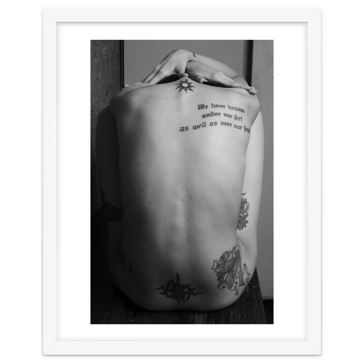 Naked body with saying as tattoo