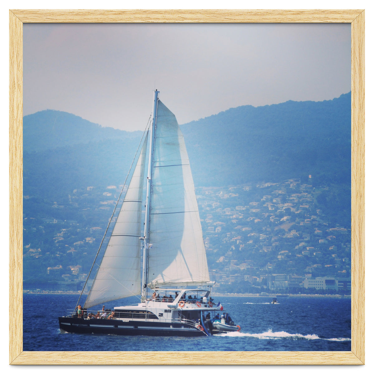 Modern yacht with white sails