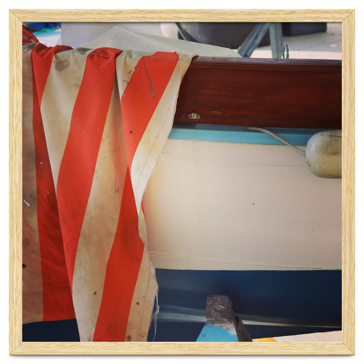 Fishing boat and striped sail