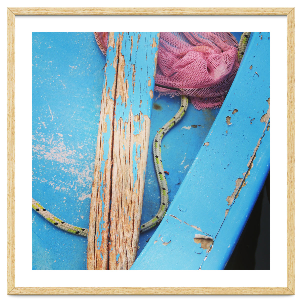 Weathered boat, sail and oar