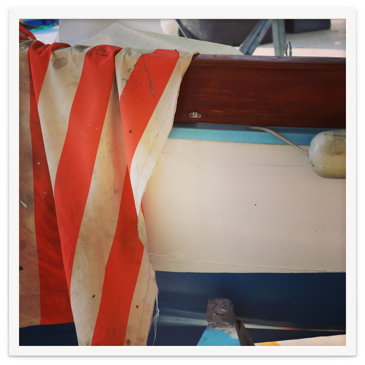 Fishing boat and striped sail