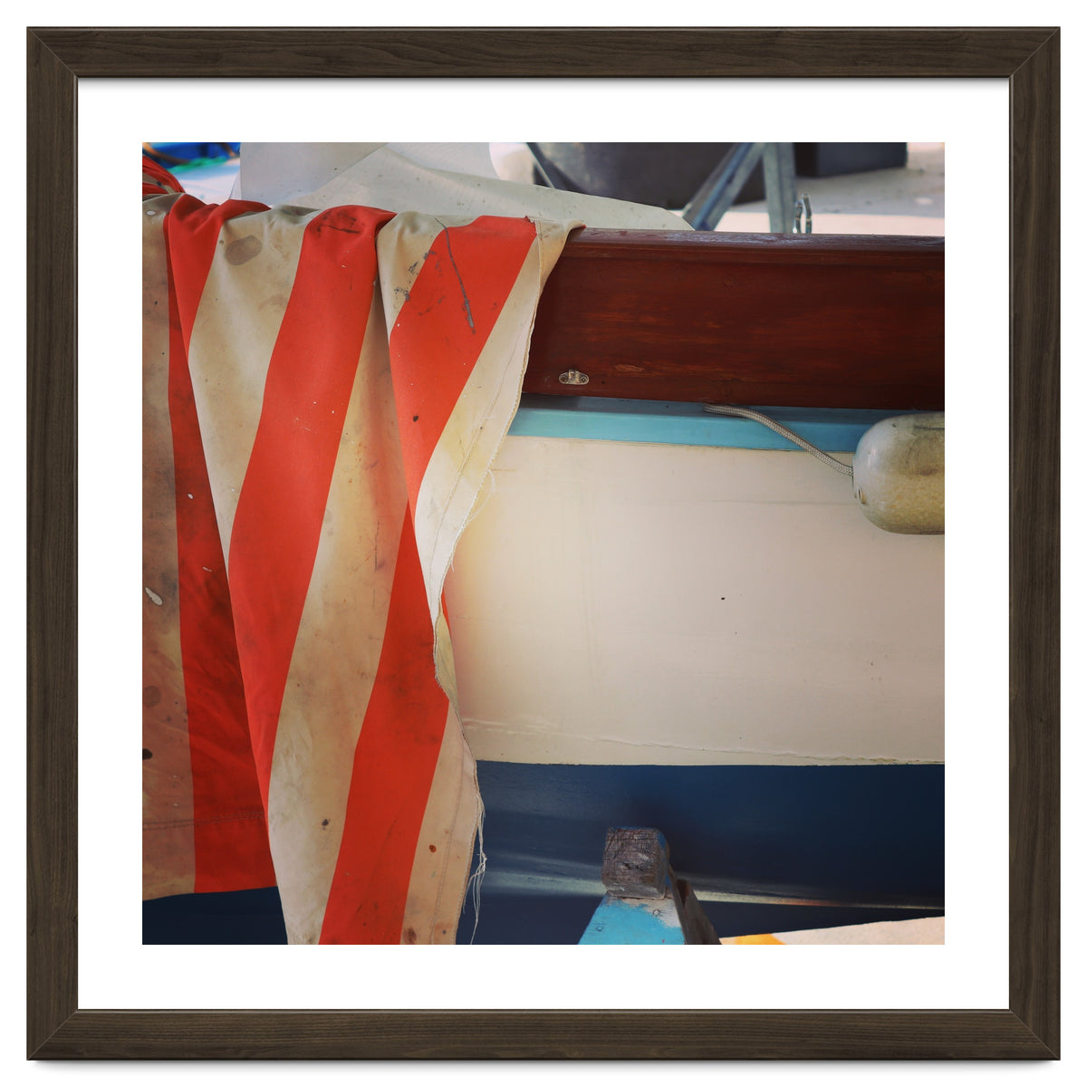 Fishing boat and striped sail