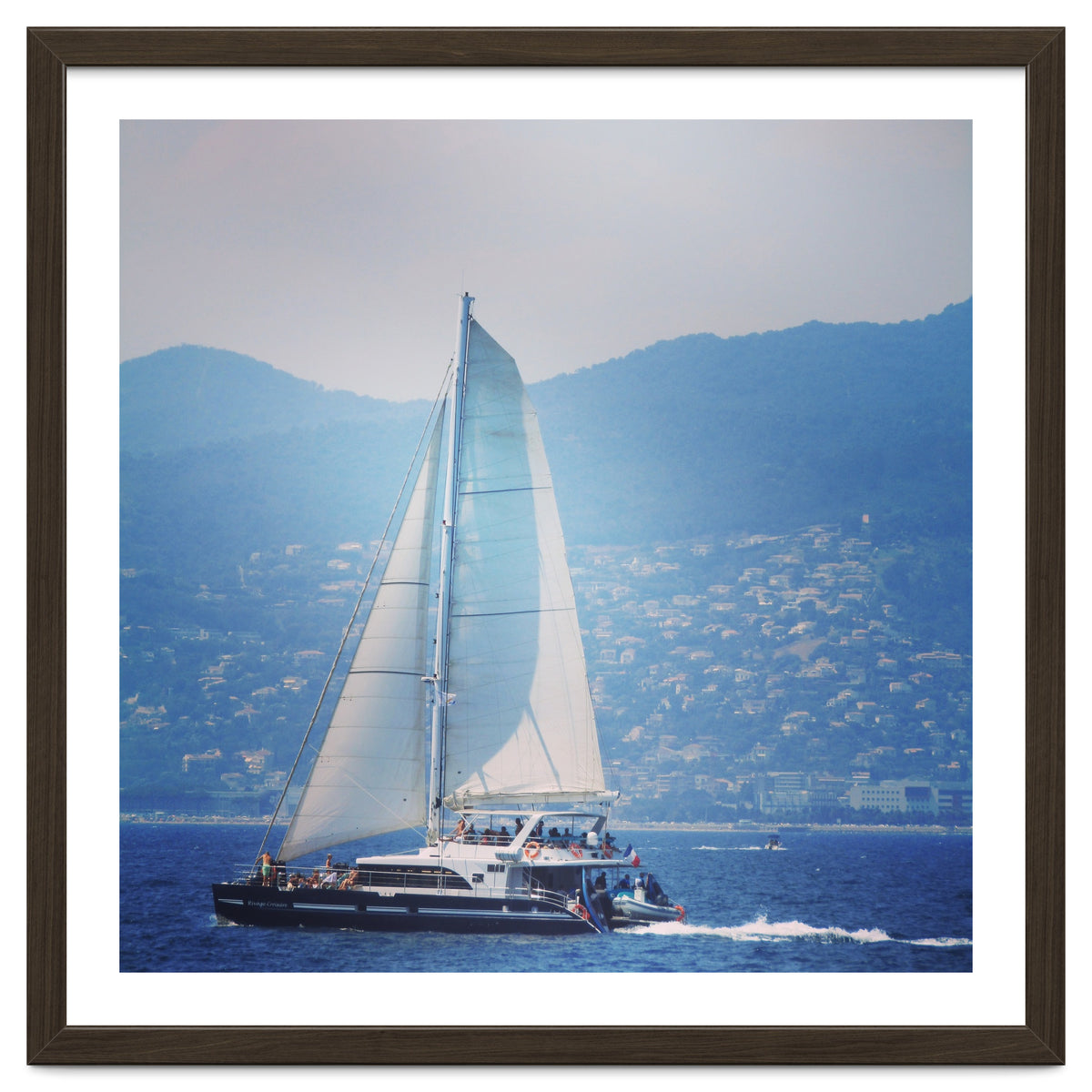 Modern yacht with white sails