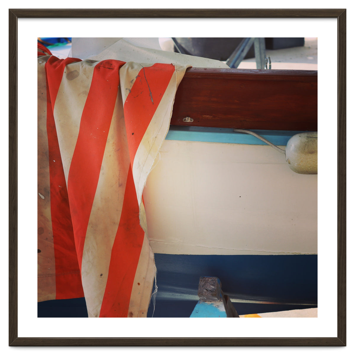 Fishing boat and striped sail