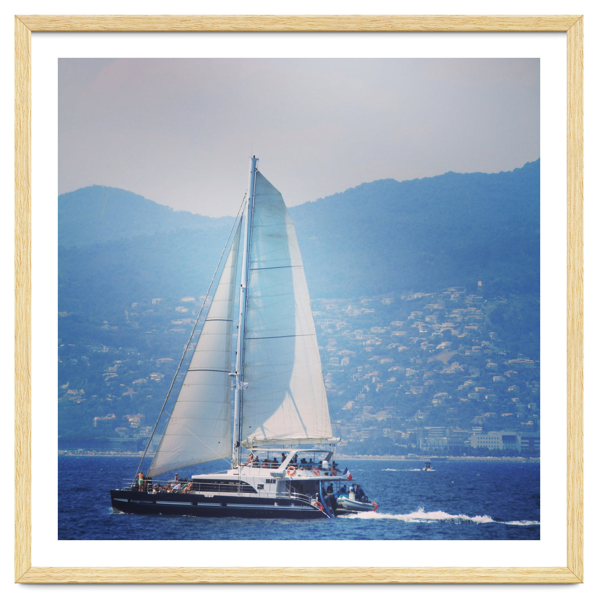 Modern yacht with white sails