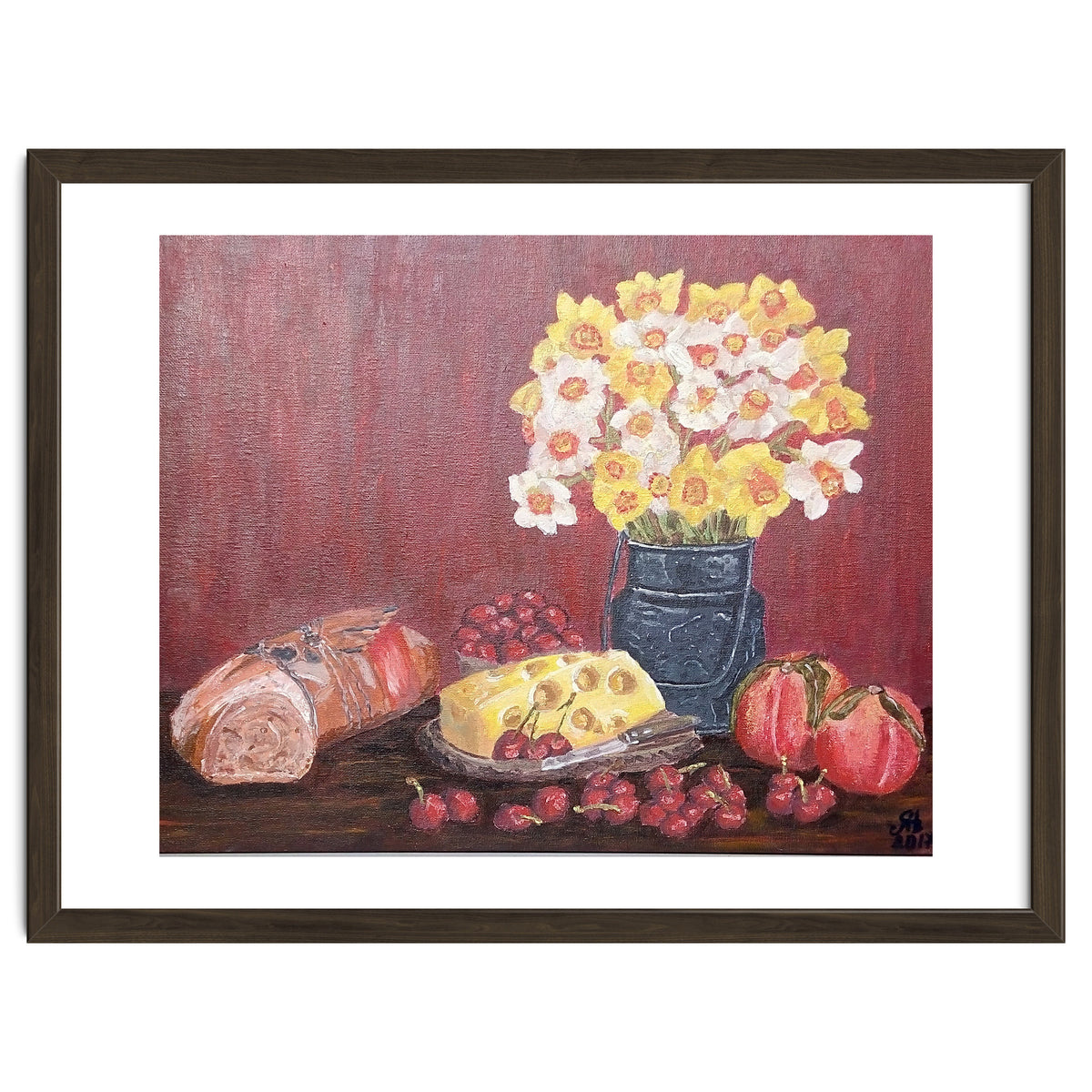 Still life with cheese, daffodils on a red background.