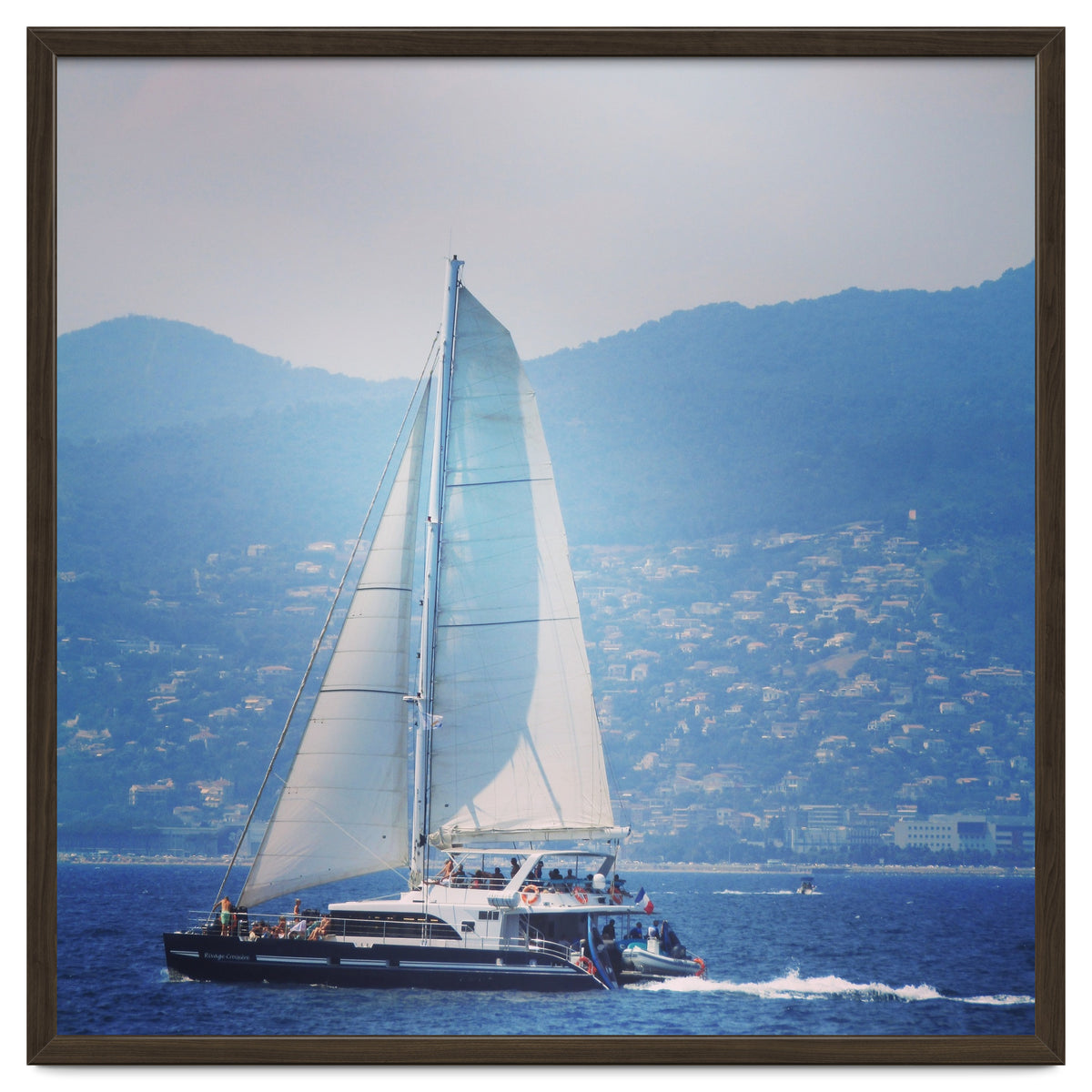 Modern yacht with white sails