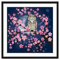 Great horned owl in a blossom tree