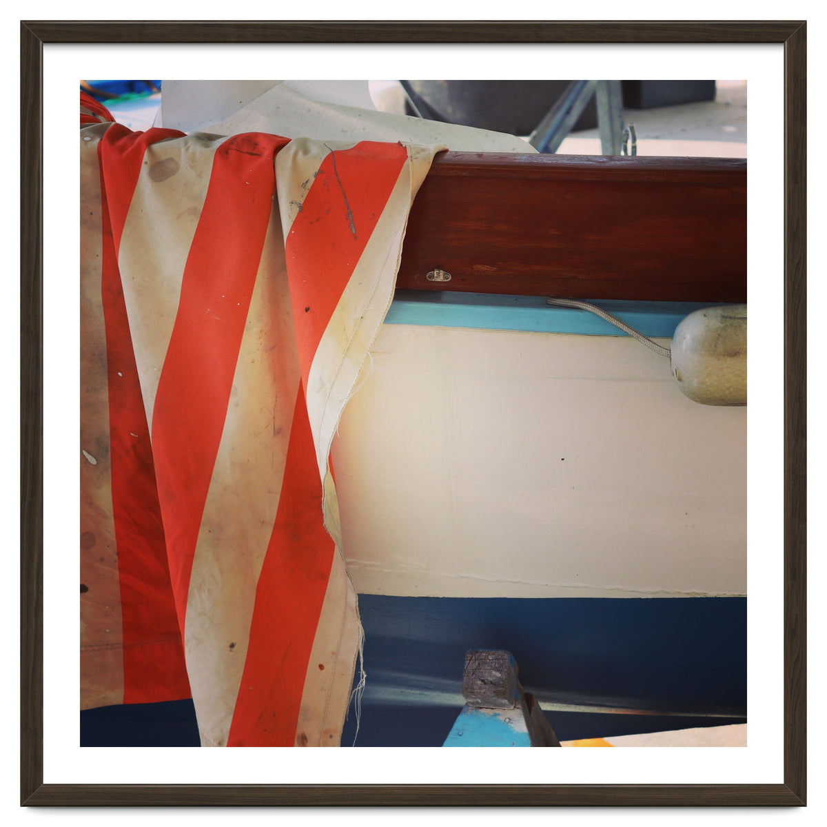 Fishing boat and striped sail