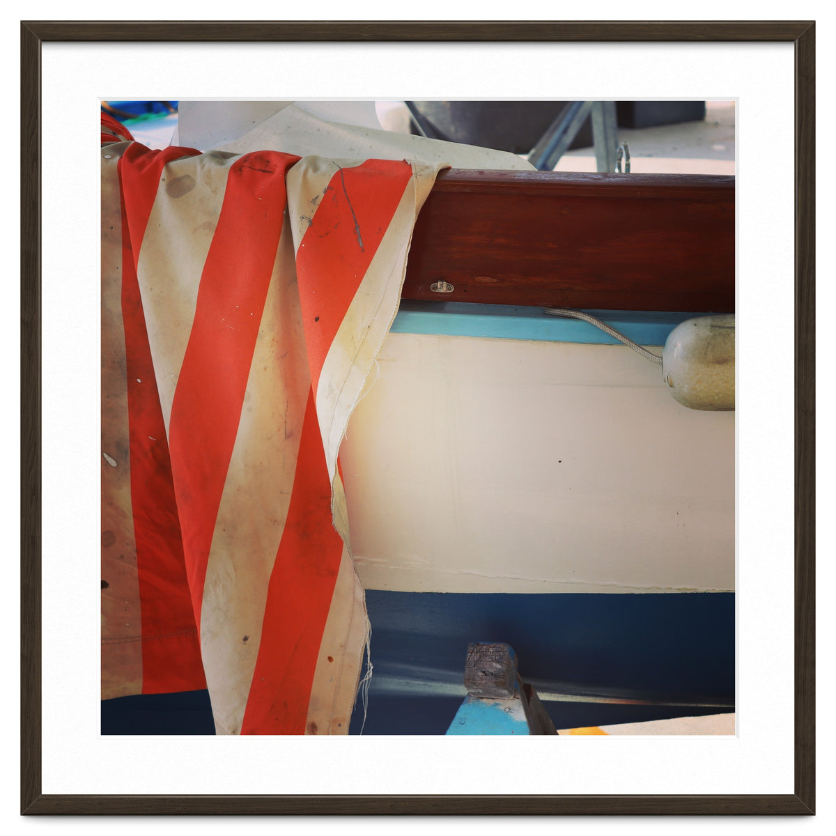 Fishing boat and striped sail