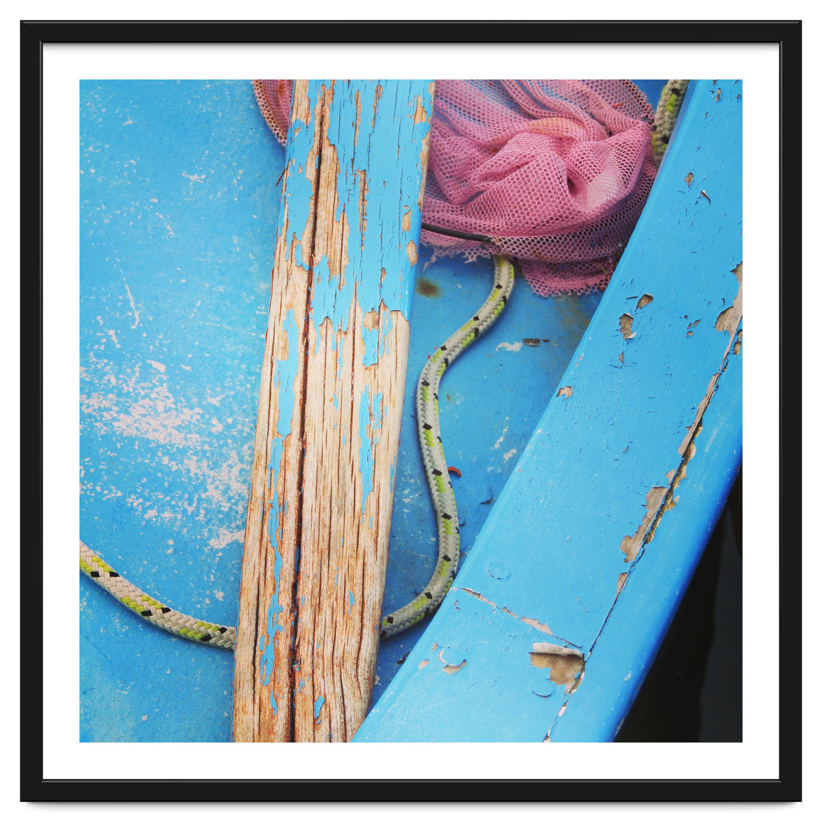 Weathered boat, sail and oar