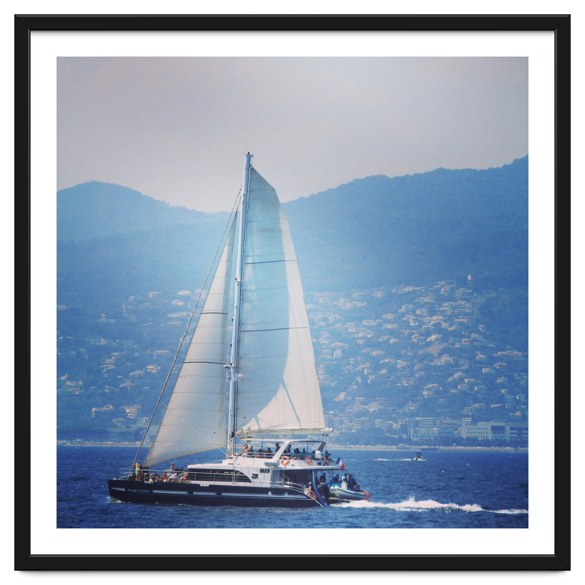 Modern yacht with white sails