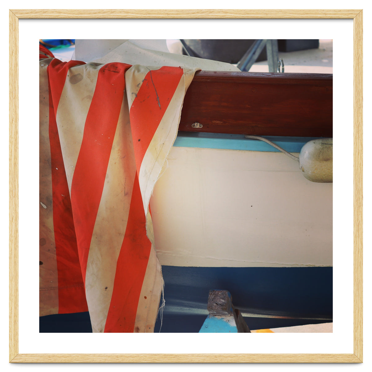 Fishing boat and striped sail